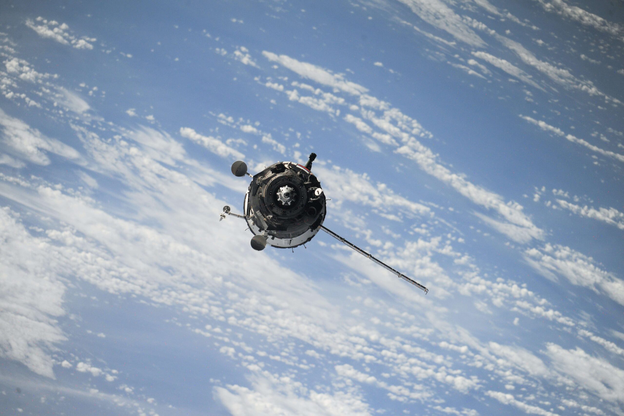 satellite floats in Earth's orbit