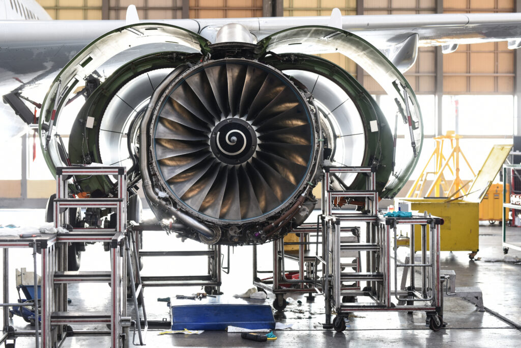 Aircraft Jet engine maintenance in airplane hangar - fasteners and fuel efficiency