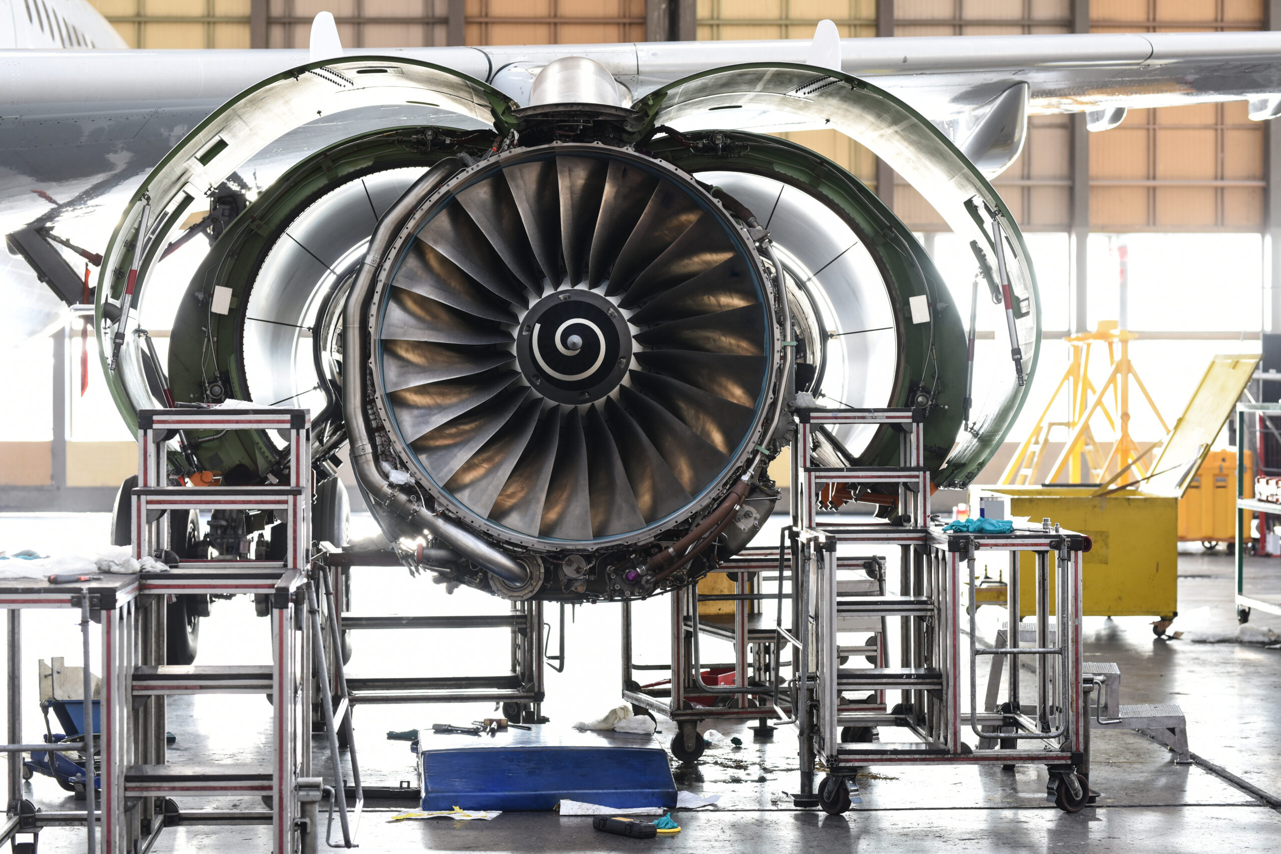 Aircraft Jet engine maintenance in airplane hangar - fasteners and fuel efficiency
